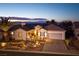Charming single-story home with desert landscaping, a tile roof, and a two-car garage at 1657 Hartley Ave, Henderson, NV 89052