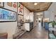 Stylish hallway with decorative artwork and bar cart, flowing into connected living spaces at 1657 Hartley Ave, Henderson, NV 89052