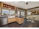 Well-lit kitchen featuring a center island, stainless steel appliances, and a connected dining area at 1657 Hartley Ave, Henderson, NV 89052