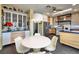Bright kitchen and breakfast area with a pendant chandelier, stainless steel refrigerator at 1657 Hartley Ave, Henderson, NV 89052