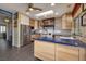 Open kitchen featuring wooden cabinetry, designer range, and stainless steel appliances at 1657 Hartley Ave, Henderson, NV 89052