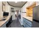 Well-lit laundry room offers generous storage and counter space with utility sink and desk area at 1657 Hartley Ave, Henderson, NV 89052