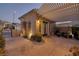 Charming covered patio with a lovely stamped concrete floor and privacy gate at 1657 Hartley Ave, Henderson, NV 89052