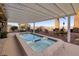 Sparkling pool with shaded seating and low-maintenance landscaping at 1657 Hartley Ave, Henderson, NV 89052