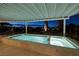 Inviting pool featuring a serene view surrounded by lush landscaping and shaded seating at 1657 Hartley Ave, Henderson, NV 89052