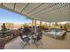 Inviting pool featuring a serene view surrounded by lush landscaping and shaded seating at 1657 Hartley Ave, Henderson, NV 89052