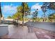 Backyard view of the patio featuring comfortable seating and desert landscaping at 1808 Scenic Sunrise Dr, Las Vegas, NV 89117