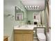 Bathroom with soft green walls, a single sink, and a toilet with a towel rack above it at 1808 Scenic Sunrise Dr, Las Vegas, NV 89117