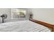 Bright bedroom with striped bedding, a window with blinds, and a decorative vase at 1808 Scenic Sunrise Dr, Las Vegas, NV 89117