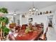 Elegant dining room with marble floors, ornate wooden table, and open concept living at 1808 Scenic Sunrise Dr, Las Vegas, NV 89117