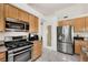Well-equipped kitchen includes stainless steel appliances and ample storage at 1808 Scenic Sunrise Dr, Las Vegas, NV 89117