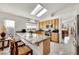 Modern kitchen featuring granite countertops, stainless steel appliances, and bright skylights at 1808 Scenic Sunrise Dr, Las Vegas, NV 89117