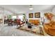 Open-concept living and dining area with marble floors, modern decor, and natural light at 1808 Scenic Sunrise Dr, Las Vegas, NV 89117