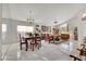 Bright living room with marble floors, dining table, and elegant furnishings at 1808 Scenic Sunrise Dr, Las Vegas, NV 89117