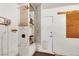 Utility closet featuring the water heater, shelving, and extra storage space at 1808 Scenic Sunrise Dr, Las Vegas, NV 89117