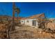 Backyard view featuring desert landscaping, patio area, and block wall for privacy, sunny and inviting at 186 Shaded Peak St, Henderson, NV 89012