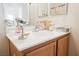 Well-lit bathroom featuring a vanity with a white countertop and wood cabinets at 186 Shaded Peak St, Henderson, NV 89012