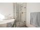 Bright bathroom featuring a freestanding tub, glass-enclosed shower, and modern fixtures at 186 Shaded Peak St, Henderson, NV 89012