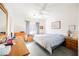 Bright bedroom with a ceiling fan, a picture frame, and a light blue comforter at 186 Shaded Peak St, Henderson, NV 89012