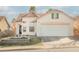 Charming single-Gathering home with a well-maintained lawn and attached two-car garage at 186 Shaded Peak St, Henderson, NV 89012