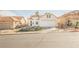 Lovely single-story home with a two-car garage and mature landscaping at 186 Shaded Peak St, Henderson, NV 89012