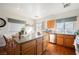 Bright kitchen with an island, stainless steel appliances, and wooden cabinetry at 186 Shaded Peak St, Henderson, NV 89012