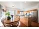 Bright kitchen with stainless steel appliances, center island, and adjacent dining area at 186 Shaded Peak St, Henderson, NV 89012