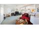 Cozy living room with a fireplace, neutral carpeting, and an open floor plan at 186 Shaded Peak St, Henderson, NV 89012