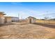Spacious gravel backyard including chain link and block fence and separate storage shed at 19 Montana Way, Henderson, NV 89015