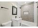 Stylish bathroom featuring a shower over tub, modern vanity, and tiled wall accents at 19 Montana Way, Henderson, NV 89015