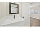 Bathroom featuring updated vanity, mirror, and modern fixtures at 19 Montana Way, Henderson, NV 89015
