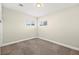 Bedroom with carpeted floors, neutral walls, and natural light from windows at 19 Montana Way, Henderson, NV 89015
