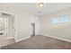 Bedroom with carpeted floors, neutral walls, closet, and ensuite bathroom at 19 Montana Way, Henderson, NV 89015