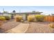 Inviting single-story home with desert landscaping, walkway, and solar panels at 19 Montana Way, Henderson, NV 89015