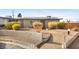 Charming single-story home with a desert landscape, solar panels, and a welcoming walkway at 19 Montana Way, Henderson, NV 89015