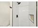 Close up of renovated shower with tile surround and tiled niche at 19 Montana Way, Henderson, NV 89015