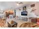 A large living room featuring a ceiling fan and an unusual selection of decor and furnishings at 2028 Rustler Ridge Ave, North Las Vegas, NV 89031