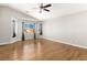 Large bedroom with vaulted ceiling, wood-look floors, and large windows for natural light at 2276 Laramine River Dr, Henderson, NV 89052