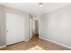 Spacious bedroom featuring wood-look flooring, closet, and neutral paint at 2276 Laramine River Dr, Henderson, NV 89052