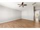Bedroom with wood-look flooring, natural light, and a ceiling fan at 2276 Laramine River Dr, Henderson, NV 89052