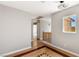 Hallway with hardwood floors and natural light; perfect for a growing Gathering at 2276 Laramine River Dr, Henderson, NV 89052