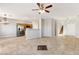 Spacious living room with an open layout, bright kitchen, and a staircase entrance at 2276 Laramine River Dr, Henderson, NV 89052