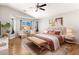 Bright main bedroom with a sitting area, a large window, and light wood flooring at 2276 Laramine River Dr, Henderson, NV 89052