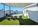 Outdoor patio area with lounge chairs overlooking the pool and green artificial grass at 2304 E Oakey Blvd, Las Vegas, NV 89104