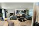 Living room with a decorative fireplace and multiple seating areas with a stylish area rug at 2304 E Oakey Blvd, Las Vegas, NV 89104