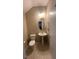 Powder room featuring a pedestal sink, toilet, and tile flooring at 257 Homeward Way, Henderson, NV 89011