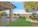 Backyard features beautiful landscaping, a stone patio with a fire pit, and artificial turf at 2869 Josephine Dr, Henderson, NV 89044