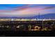 An illuminated cityscape view in the distance, with neighborhood and mountains in background at 2869 Josephine Dr, Henderson, NV 89044