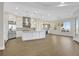 Open-concept kitchen featuring stainless steel appliances, a large island, and a seamless transition to living area at 2869 Josephine Dr, Henderson, NV 89044