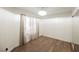 Bright bedroom with hard floors, neutral paint, and closet with mirrored doors at 3038 Tarpon Dr # 102, Las Vegas, NV 89120